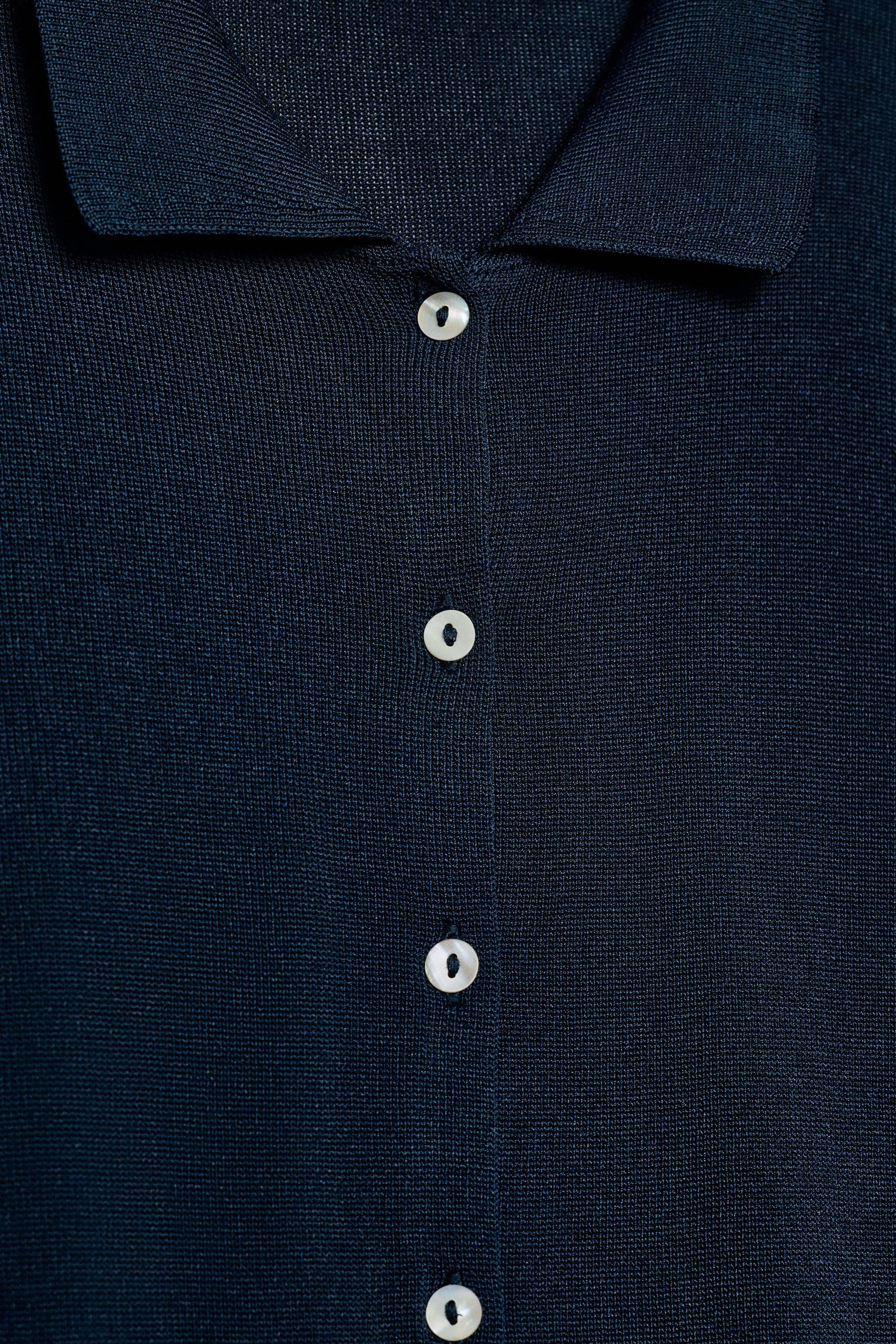 GILET EN MAILLE À MANCHES COURTES